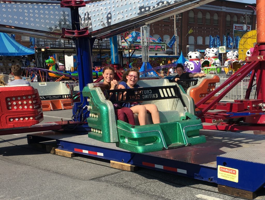 Taylor Abby and Mackenzie in twirly thing at Great Allentown Fair